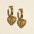 Block O Huggie Earrings